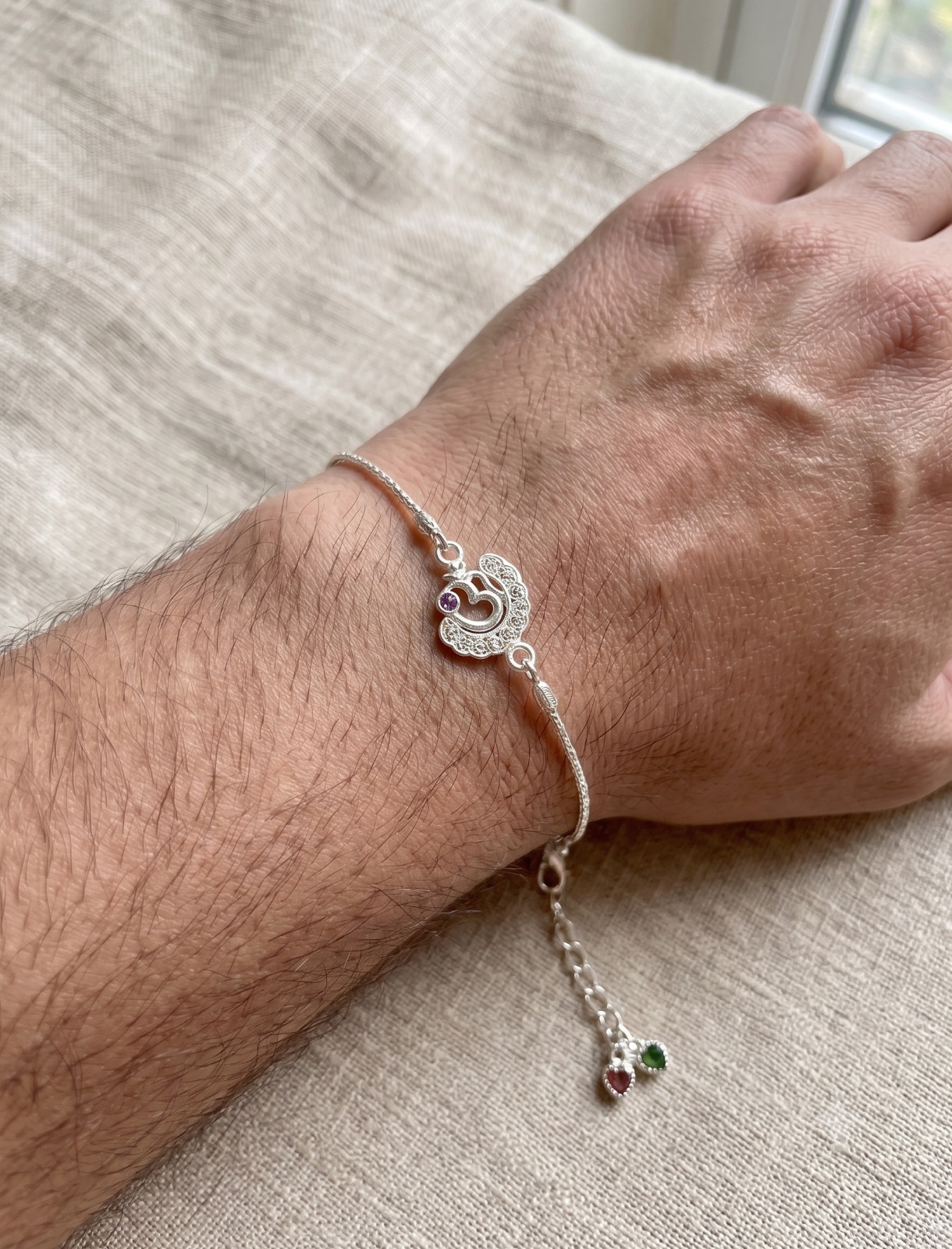 Silver Om Spark Rakhi